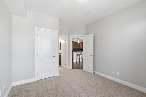 2208-15 Sunset Square, Cochrane, AB - Indoor Photo Showing Other Room