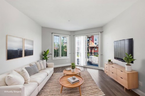 2208-15 Sunset Square, Cochrane, AB - Indoor Photo Showing Living Room