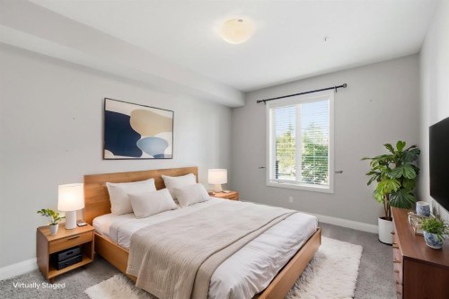 2208-15 Sunset Square, Cochrane, AB - Indoor Photo Showing Bedroom