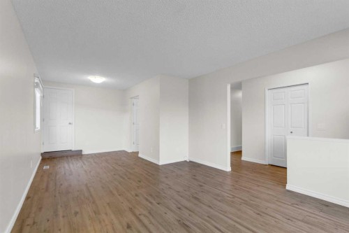 452 Queen Alexandra Way Se, Calgary, AB - Indoor Photo Showing Other Room