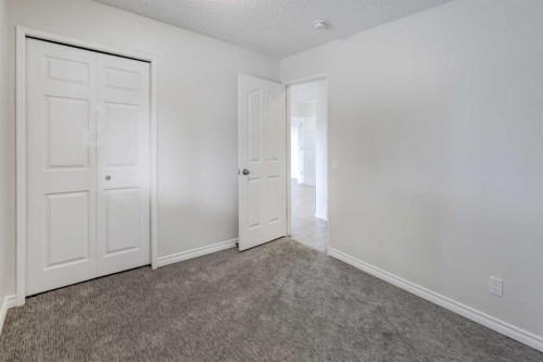 452 Queen Alexandra Way Se, Calgary, AB - Indoor Photo Showing Other Room