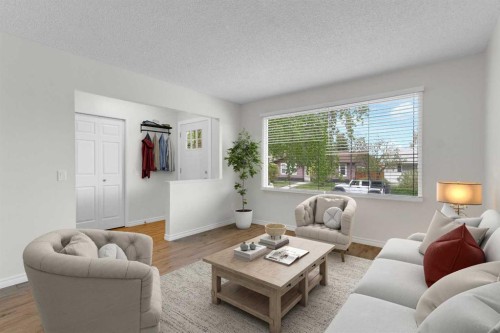 452 Queen Alexandra Way Se, Calgary, AB - Indoor Photo Showing Living Room