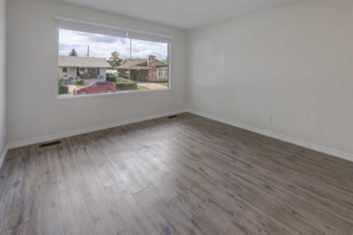 452 Queen Alexandra Way Se, Calgary, AB - Indoor Photo Showing Other Room