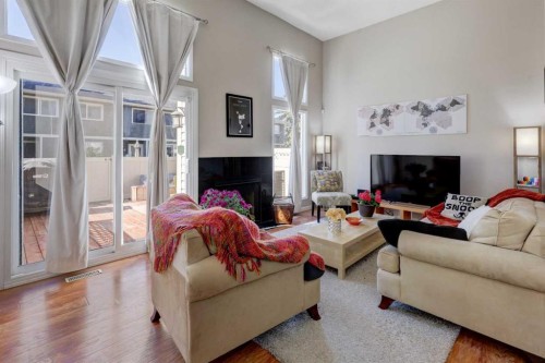 738 Queenston Terrace Se, Calgary, AB - Indoor Photo Showing Living Room With Fireplace