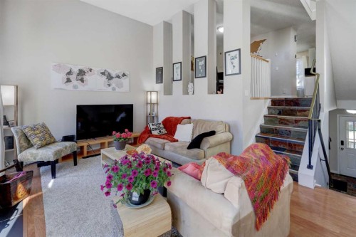 738 Queenston Terrace Se, Calgary, AB - Indoor Photo Showing Living Room