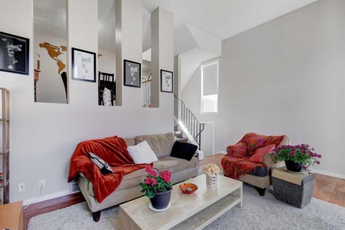 738 Queenston Terrace Se, Calgary, AB - Indoor Photo Showing Living Room