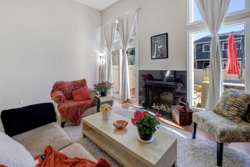 738 Queenston Terrace Se, Calgary, AB - Indoor Photo Showing Living Room With Fireplace