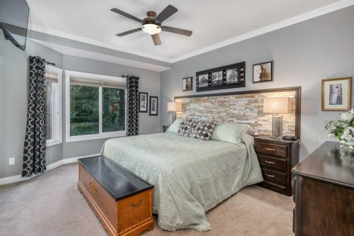 61 River Heights View, Cochrane, AB - Indoor Photo Showing Bedroom