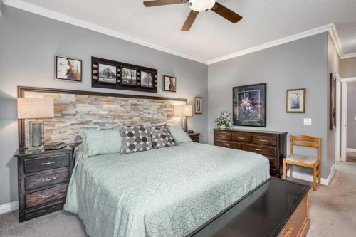61 River Heights View, Cochrane, AB - Indoor Photo Showing Bedroom