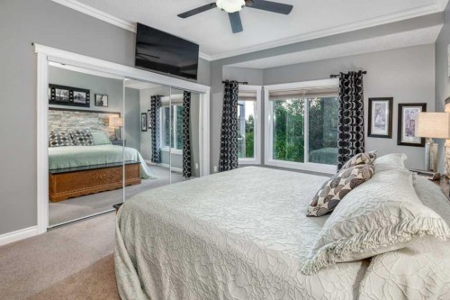 61 River Heights View, Cochrane, AB - Indoor Photo Showing Bedroom