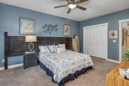 61 River Heights View, Cochrane, AB - Indoor Photo Showing Bedroom