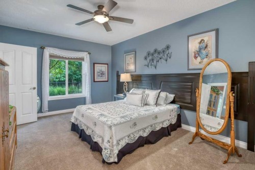 61 River Heights View, Cochrane, AB - Indoor Photo Showing Bedroom