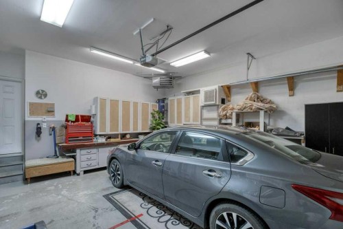 61 River Heights View, Cochrane, AB - Indoor Photo Showing Garage