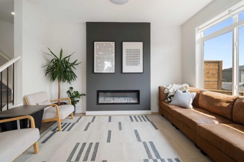 4 Mill Road, Cochrane, AB - Indoor Photo Showing Living Room With Fireplace