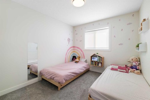4 Mill Road, Cochrane, AB - Indoor Photo Showing Bedroom