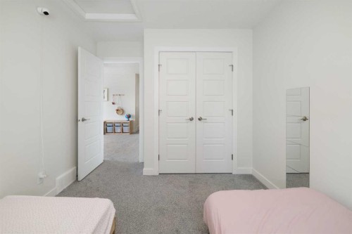 4 Mill Road, Cochrane, AB - Indoor Photo Showing Bedroom