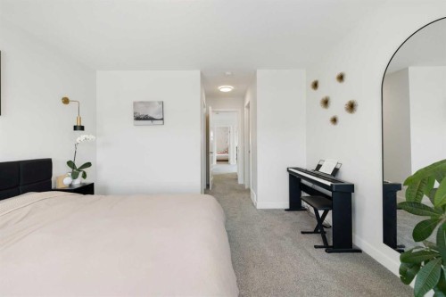 4 Mill Road, Cochrane, AB - Indoor Photo Showing Bedroom