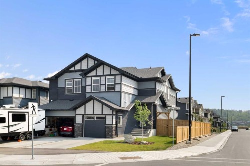 4 Mill Road, Cochrane, AB - Outdoor With Facade