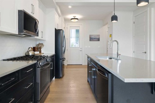 4 Mill Road, Cochrane, AB - Indoor Photo Showing Kitchen With Upgraded Kitchen