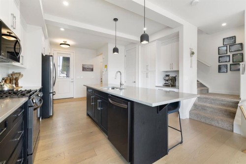 4 Mill Road, Cochrane, AB - Indoor Photo Showing Kitchen With Double Sink With Upgraded Kitchen