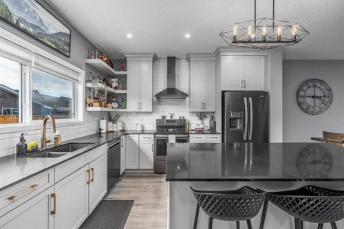 250 Belmont Heath Sw, Calgary, AB - Indoor Photo Showing Kitchen With Double Sink With Upgraded Kitchen