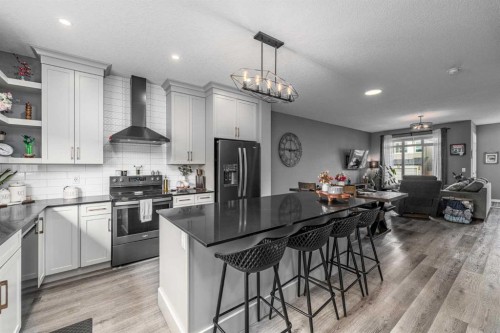 250 Belmont Heath Sw, Calgary, AB - Indoor Photo Showing Kitchen With Double Sink With Upgraded Kitchen