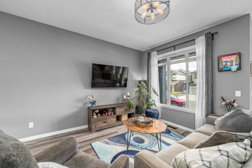 250 Belmont Heath Sw, Calgary, AB - Indoor Photo Showing Living Room