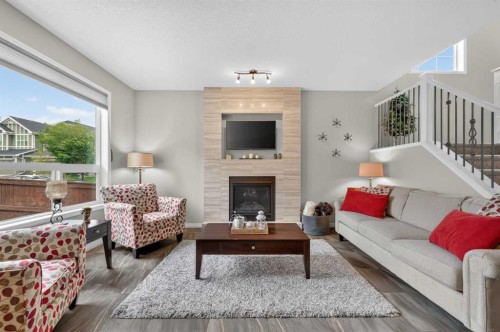 131 Cranarch Crescent Se, Calgary, AB - Indoor Photo Showing Living Room With Fireplace