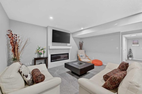 131 Cranarch Crescent Se, Calgary, AB - Indoor Photo Showing Living Room With Fireplace