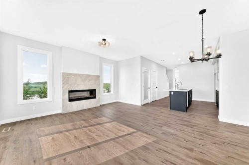186 Lanark Gate Se, Airdrie, AB - Indoor Photo Showing Living Room With Fireplace