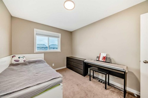 109 New Brighton Park Se, Calgary, AB - Indoor Photo Showing Bedroom