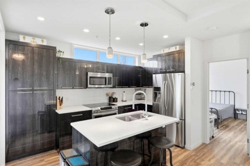 304-317 22 Avenue Sw, Calgary, AB - Indoor Photo Showing Kitchen With Stainless Steel Kitchen With Double Sink With Upgraded Kitchen