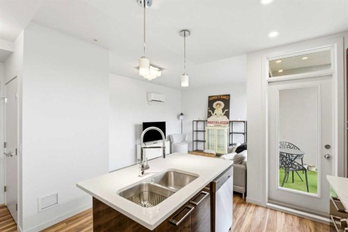 304-317 22 Avenue Sw, Calgary, AB - Indoor Photo Showing Kitchen With Double Sink