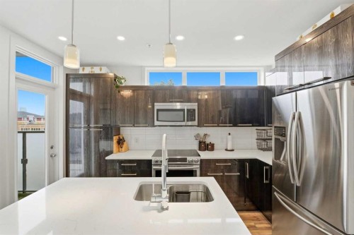 304-317 22 Avenue Sw, Calgary, AB - Indoor Photo Showing Kitchen With Stainless Steel Kitchen With Double Sink With Upgraded Kitchen