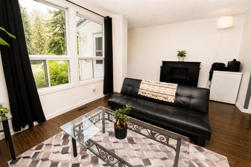 6527 Huntsbay Road Nw, Calgary, AB - Indoor Photo Showing Living Room
