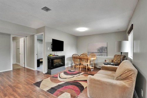 418 Long Beach Landing, Chestermere, AB - Indoor Photo Showing Living Room With Fireplace