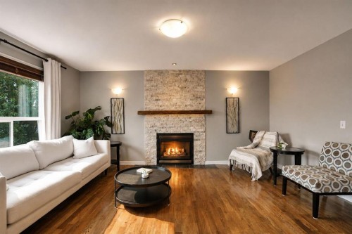 418 Long Beach Landing, Chestermere, AB - Indoor Photo Showing Living Room With Fireplace