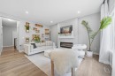 902 Bluerock Way Sw, Calgary, AB  - Indoor Photo Showing Living Room With Fireplace 