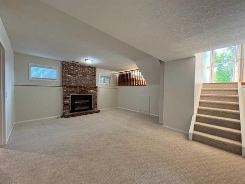 228 Erin Woods Drive Se, Calgary, AB - Indoor With Fireplace