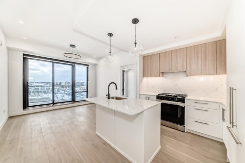 415-8375 Broadcast Avenue Sw, Calgary, AB - Indoor Photo Showing Kitchen With Upgraded Kitchen