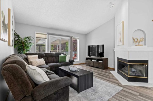 26 Chaparral Close Se, Calgary, AB - Indoor Photo Showing Living Room With Fireplace