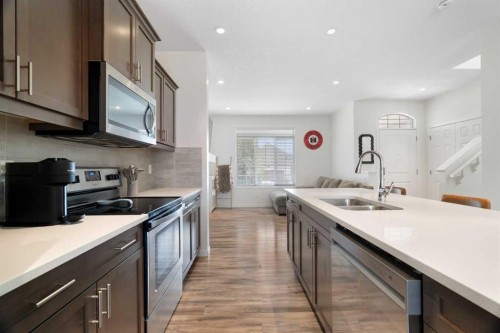 57 Amery Crescent, Crossfield, AB - Indoor Photo Showing Kitchen With Stainless Steel Kitchen With Double Sink With Upgraded Kitchen