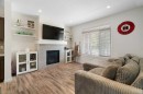 57 Amery Crescent, Crossfield, AB  - Indoor Photo Showing Living Room With Fireplace 