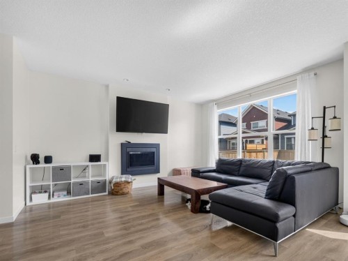 228 Masters Crescent Se, Calgary, AB - Indoor Photo Showing Living Room With Fireplace
