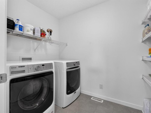 228 Masters Crescent Se, Calgary, AB - Indoor Photo Showing Laundry Room