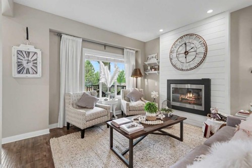 99 Mahogany Row Se, Calgary, AB - Indoor Photo Showing Living Room With Fireplace