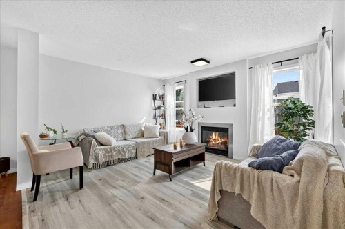 333 Bridleridge View Sw, Calgary, AB - Indoor Photo Showing Living Room With Fireplace
