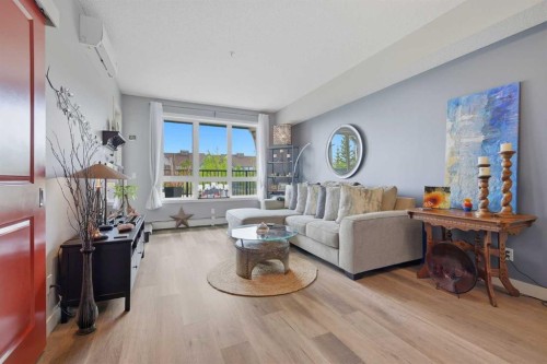 1106-175 Silverado Boulevard Sw, Calgary, AB - Indoor Photo Showing Living Room