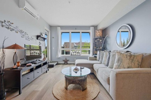 1106-175 Silverado Boulevard Sw, Calgary, AB - Indoor Photo Showing Living Room