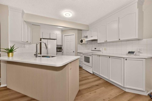 137 Douglas Glen Manor Se, Calgary, AB - Indoor Photo Showing Kitchen With Double Sink